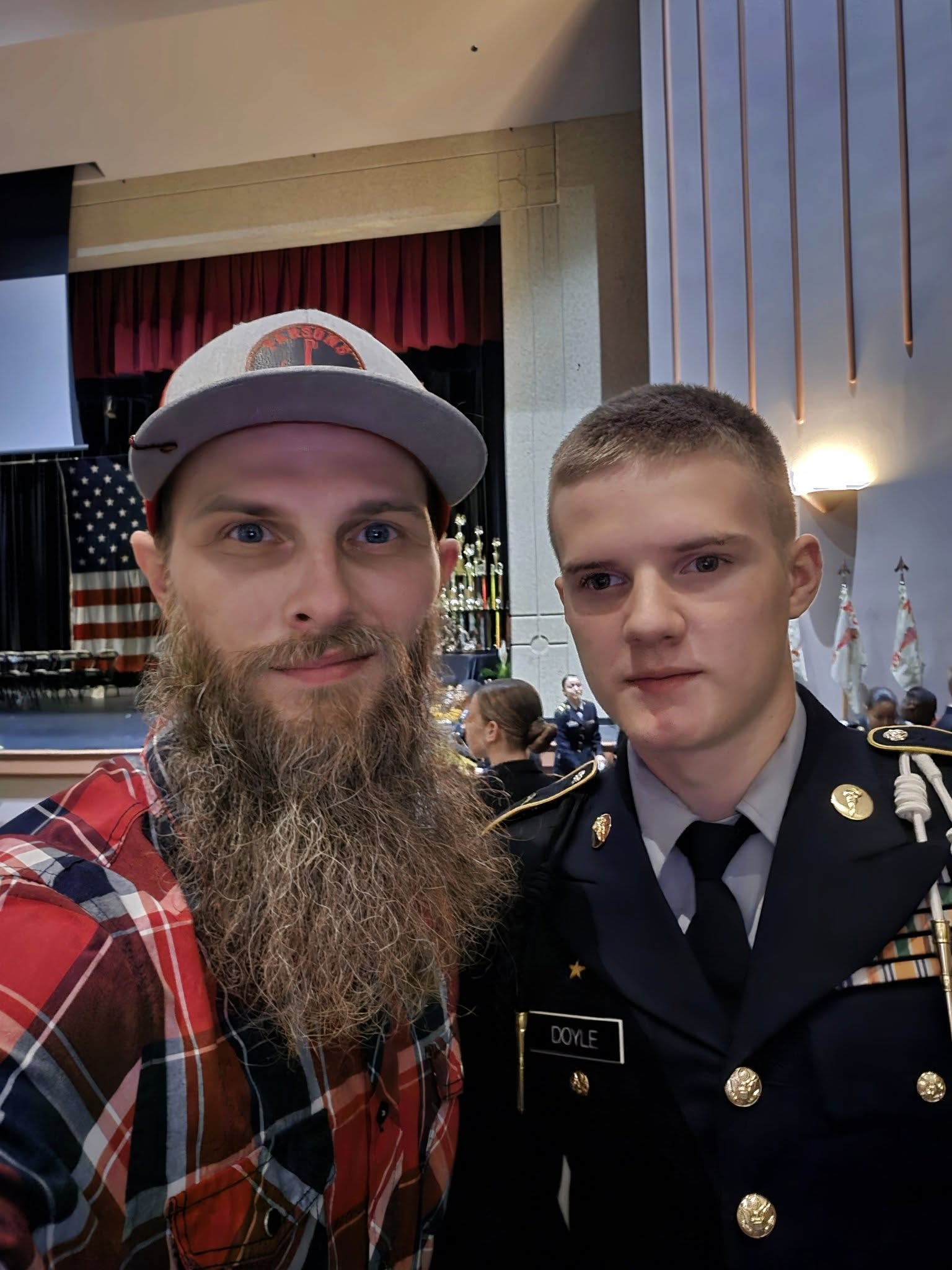David with his son holding a fish
